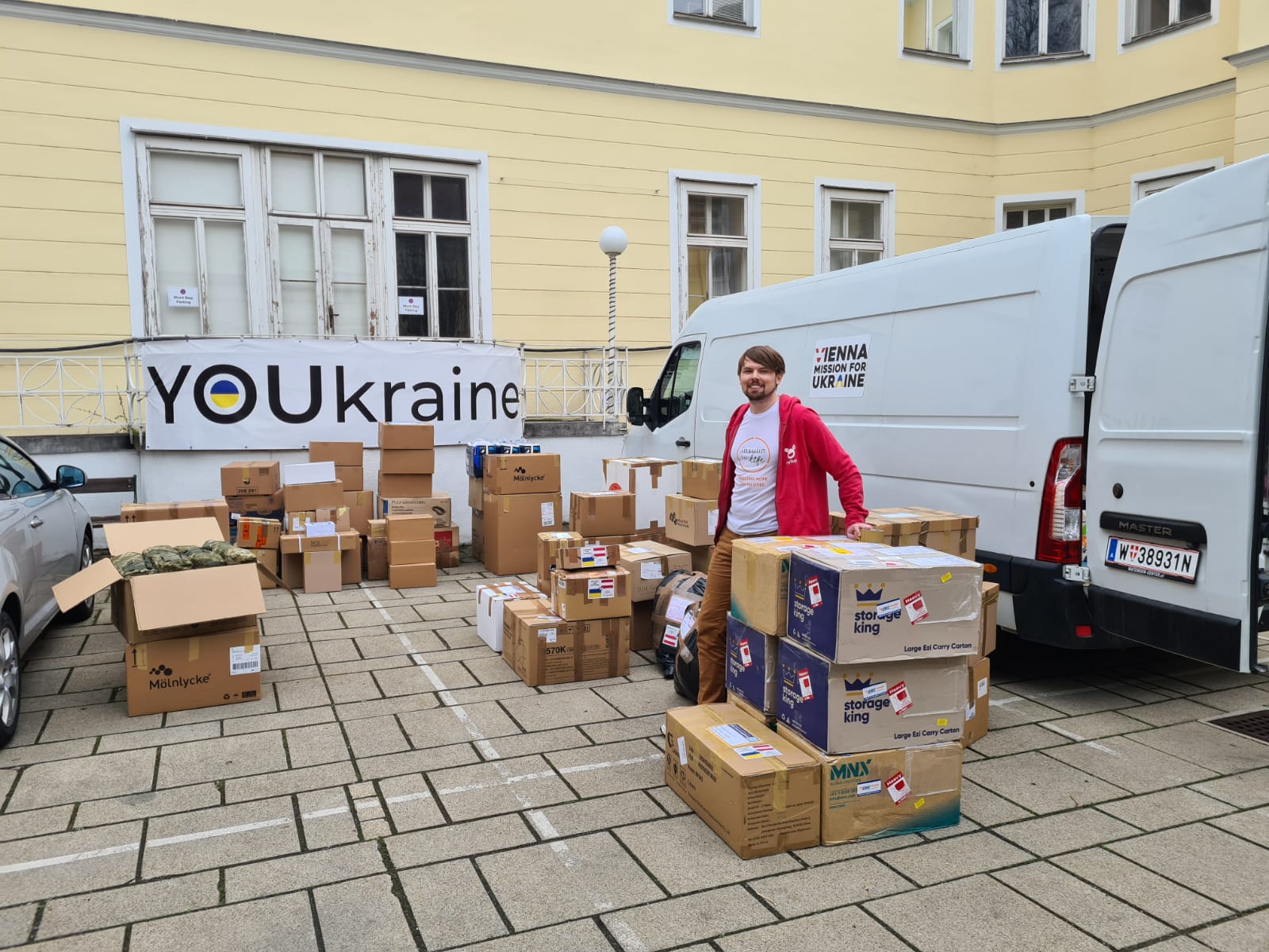 Oleg loading insulin and medical supplies for diabetics into the new van.