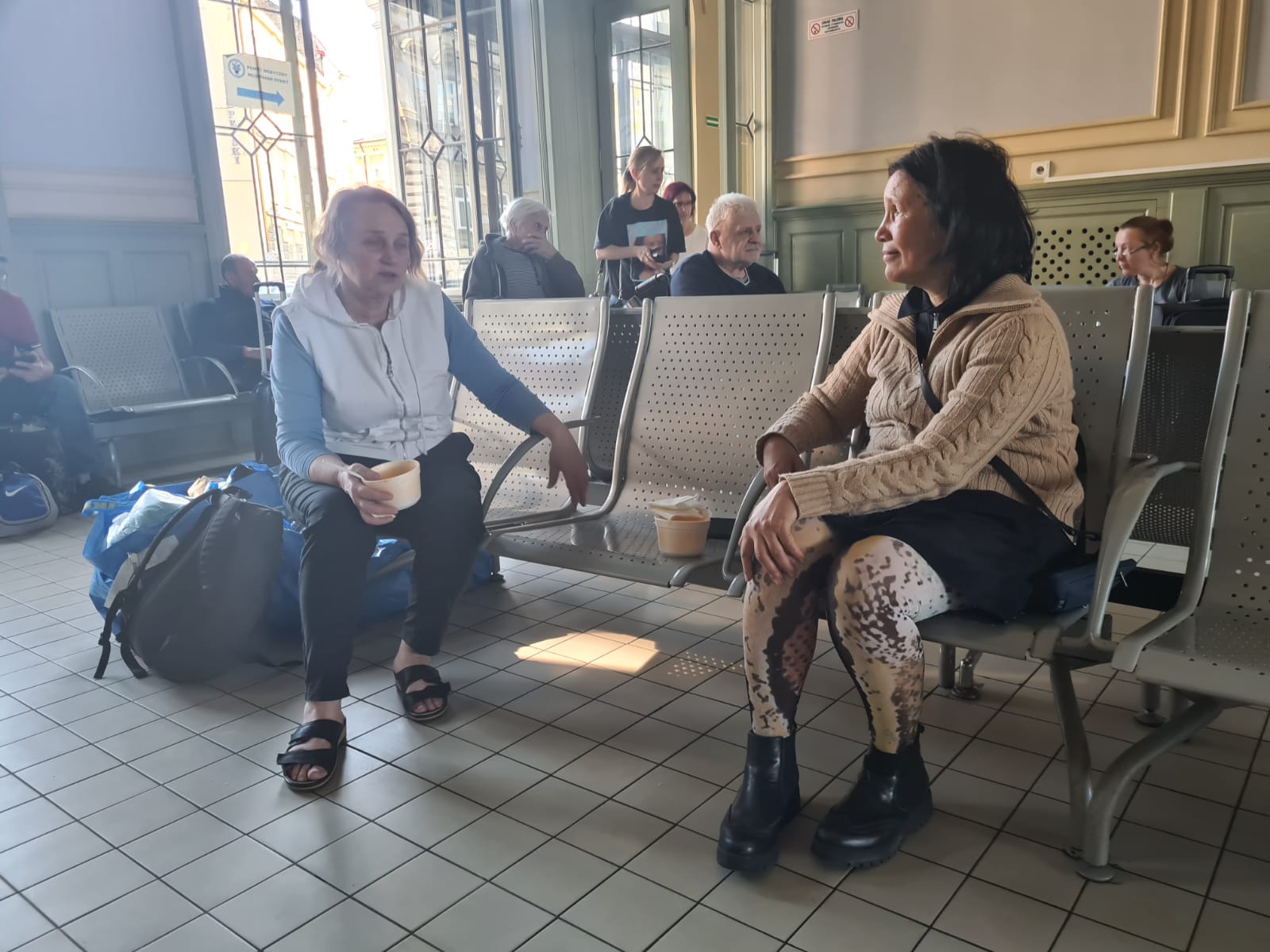 Svetlana and Lyubov chatting over goulash at Przemysl Train Station during the Shklo Repatriation Mission.